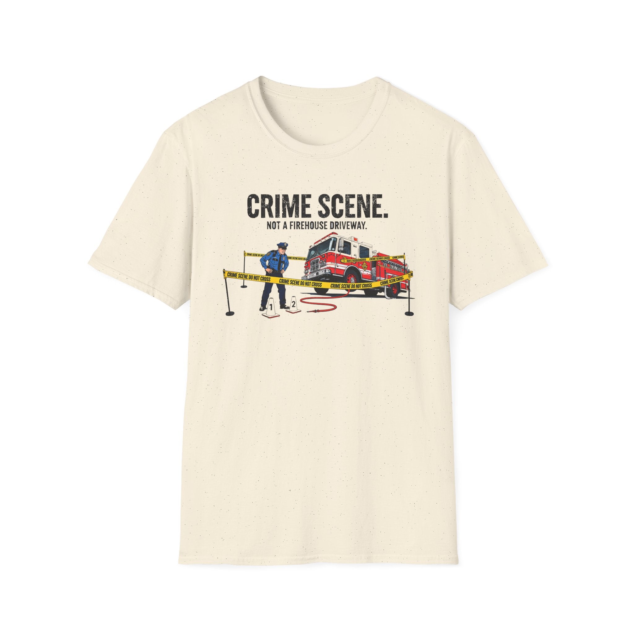 Beige t-shirt with a graphic of a police officer and fire truck and text 'Crime Scene. Not a Firehouse Driveway.'